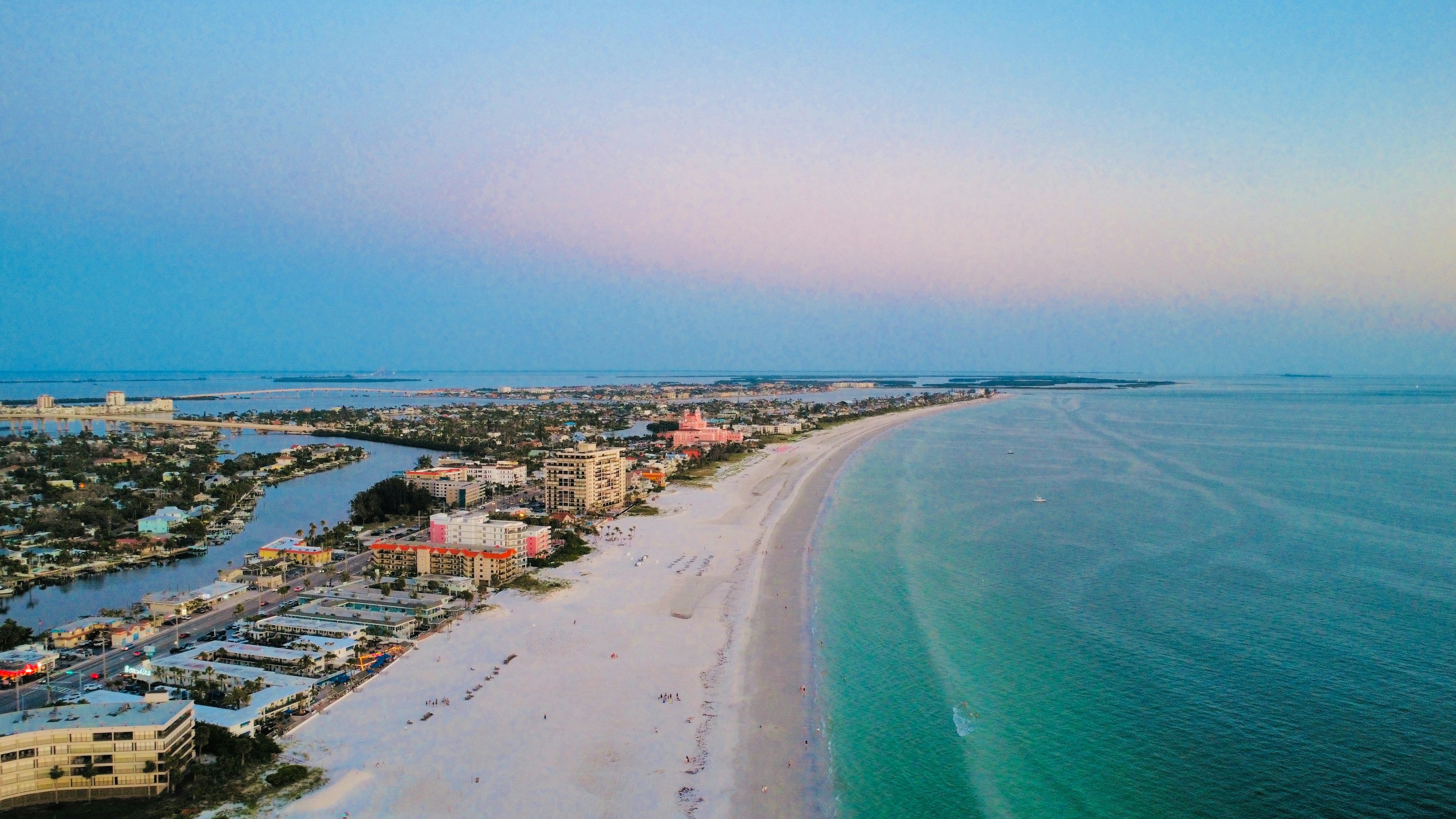 Aerial view of St. Pete Beach with the pink Don CeSar hotel, white sand and turquoise Gulf water